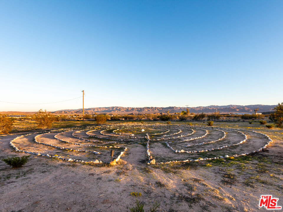 2724 Stonehill Avenue Joshua Tree, CA 92252 - Photo 48 of 65 an aerial view of residential building with parking space