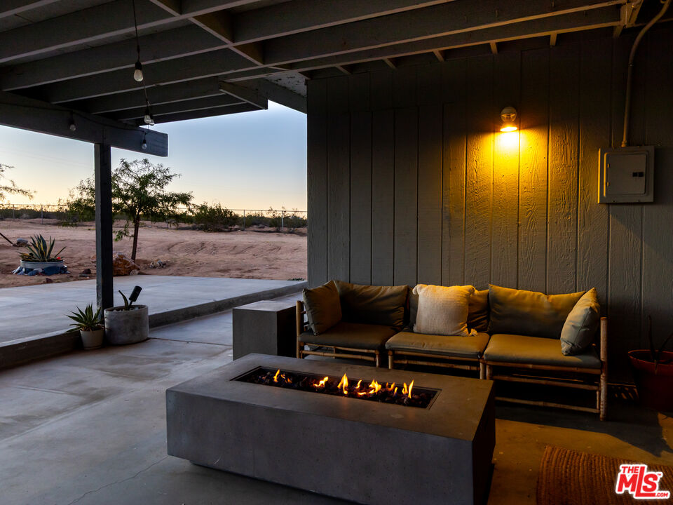 2724 Stonehill Avenue Joshua Tree, CA 92252 - Photo 54 of 65 a roof deck with couch and chairs