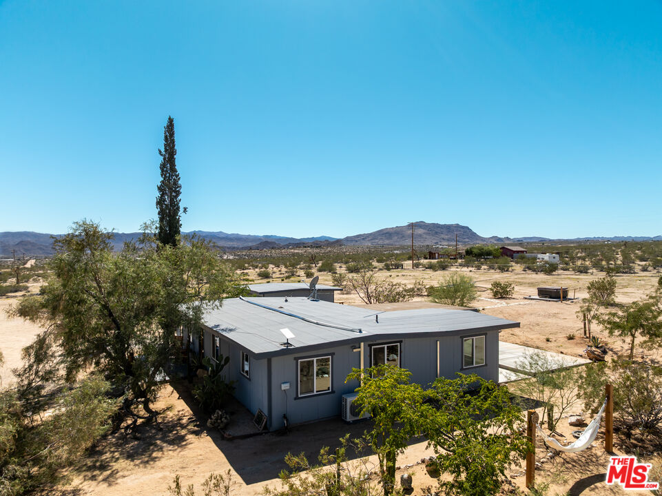 2724 Stonehill Avenue Joshua Tree, CA 92252 - Photo 62 of 65 a view of a city with a building in the background