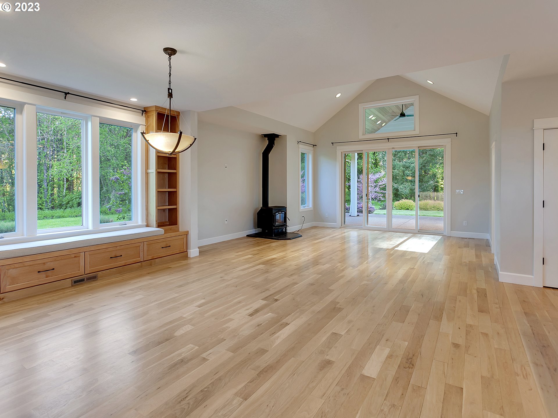 16939 Southwest Wilsonville Road Wilsonville, OR 97070 - Photo 13 of 43 a view of a room with wooden floor staircase and windows