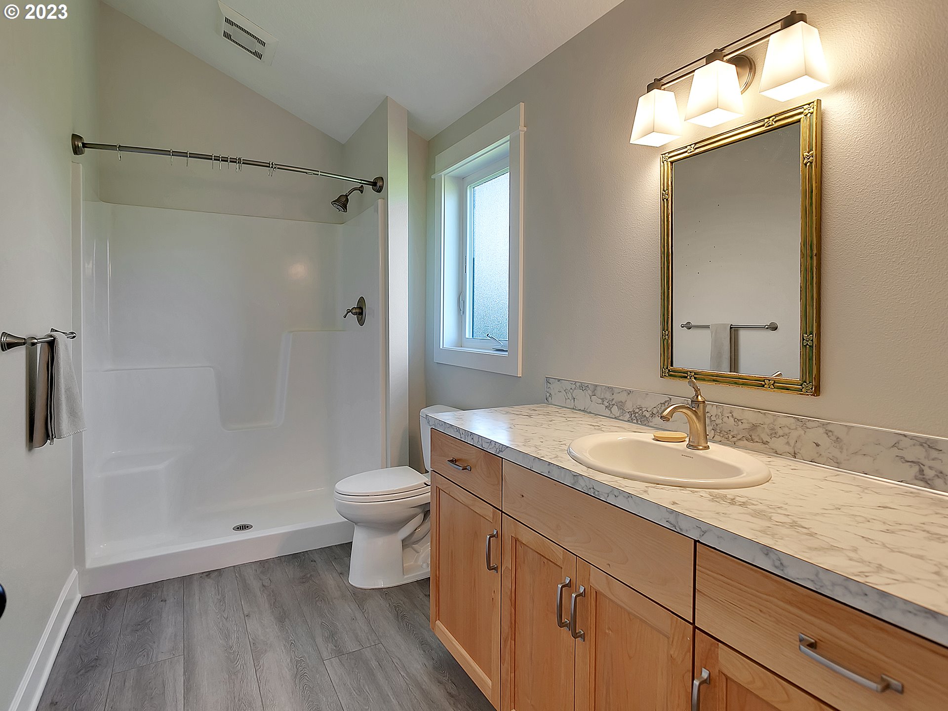 16939 Southwest Wilsonville Road Wilsonville, OR 97070 - Photo 39 of 43 a bathroom with a granite countertop sink toilet and shower