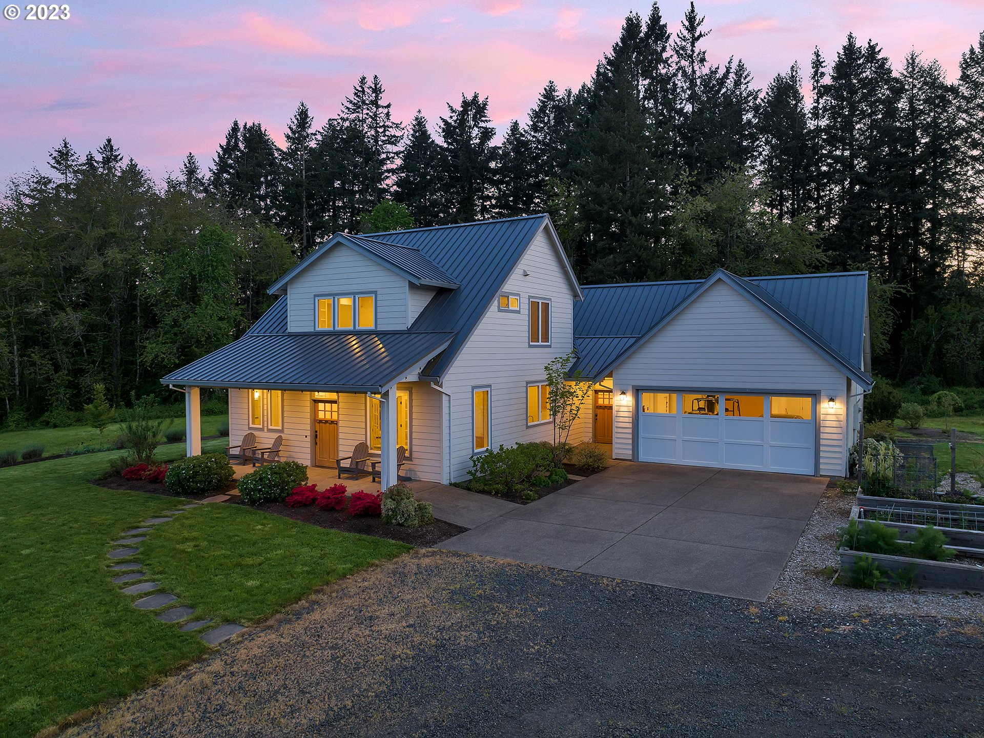 16939 Southwest Wilsonville Road Wilsonville, OR 97070 - Photo 6 of 43 a front view of a house with a yard and garage