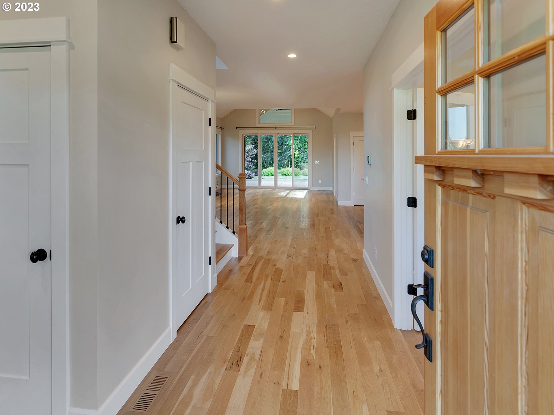 16939 Southwest Wilsonville Road Wilsonville, OR 97070 - Photo 7 of 43 a view of a hallway with wooden floor and staircase