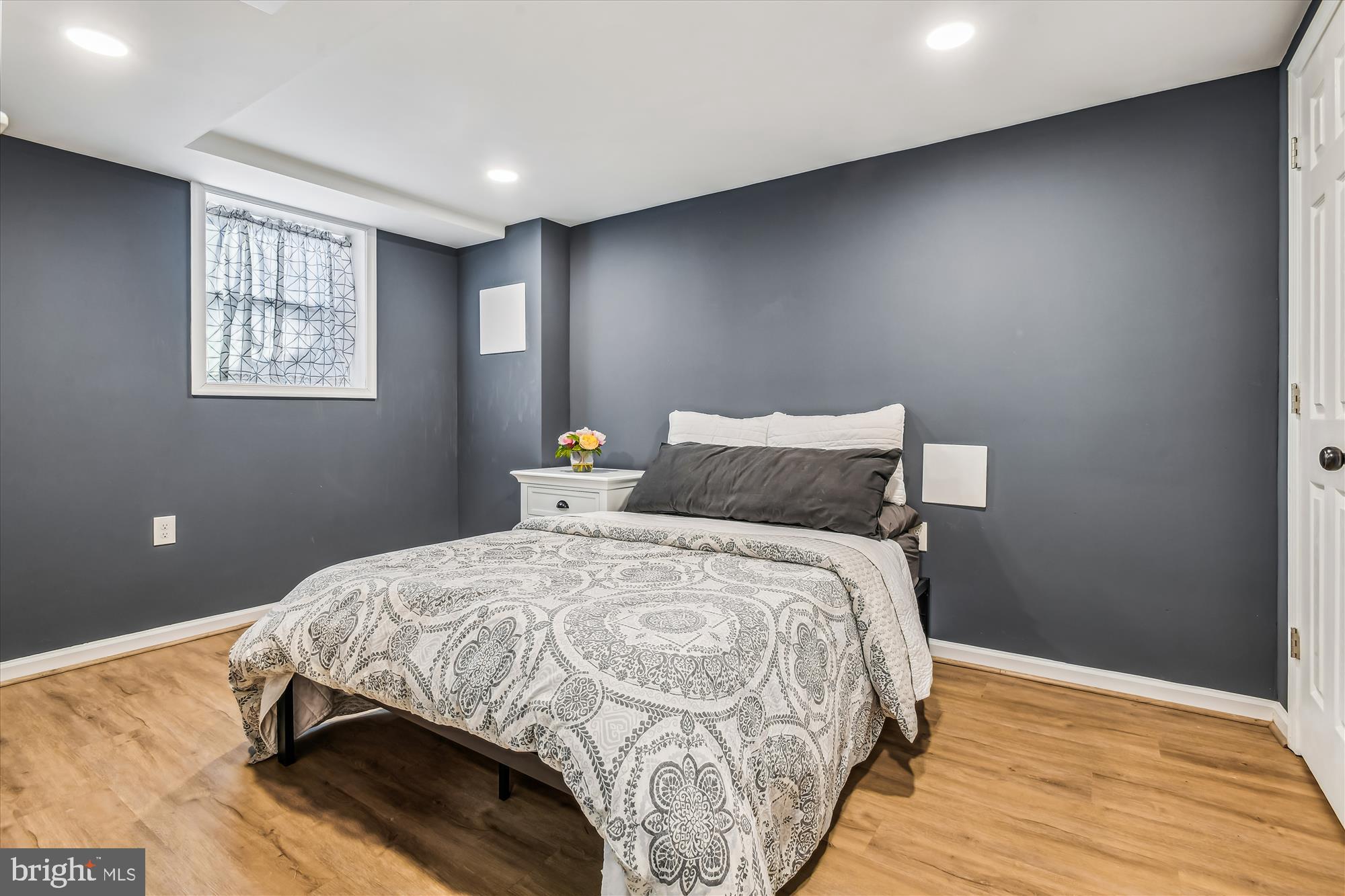 232 Candytuft Road Reisterstown, MD 21136 - Photo 24 of 42 a bedroom with a bed and wooden floor