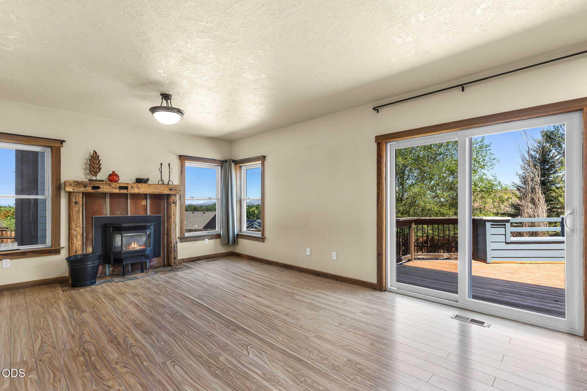 2486 Southwest Valleyview Drive Redmond, OR 97756 - Photo 14 of 55 a view of a livingroom with a fireplace and window