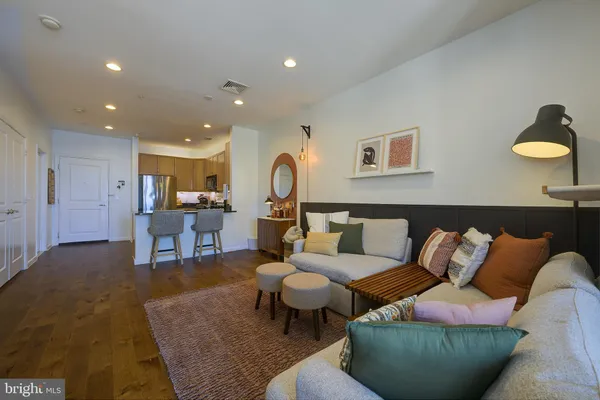 a living room with furniture and a rug