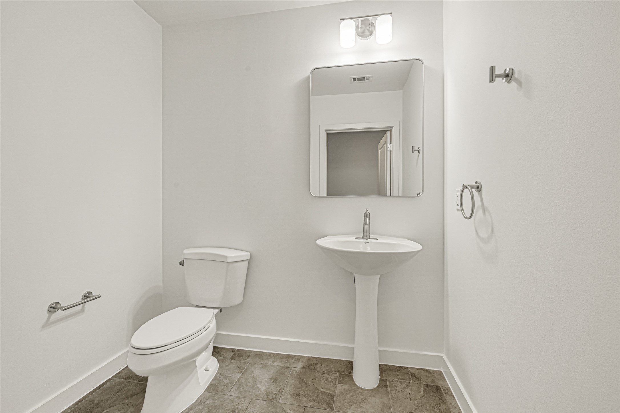 5925 Almeda Road, Unit 11508 Houston, TX 77004 - Photo 11 of 44 a bathroom with a toilet sink and mirror