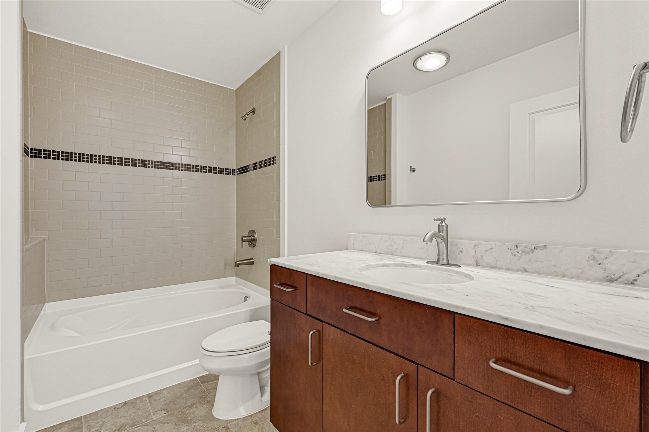 5925 Almeda Road, Unit 11508 Houston, TX 77004 - Photo 17 of 44 a bathroom with a granite countertop sink toilet and shower