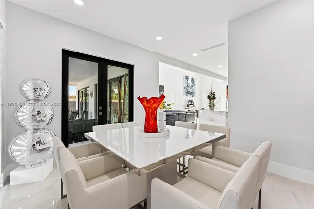 a view of a swimming pool with sitting area