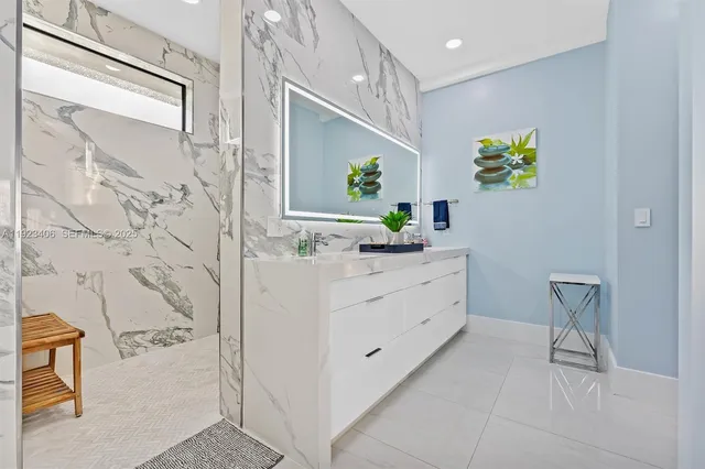 an aerial view of a house with a yard basket ball court and outdoor seating