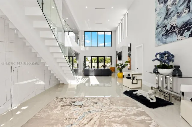 a kitchen with kitchen island appliances and cabinets