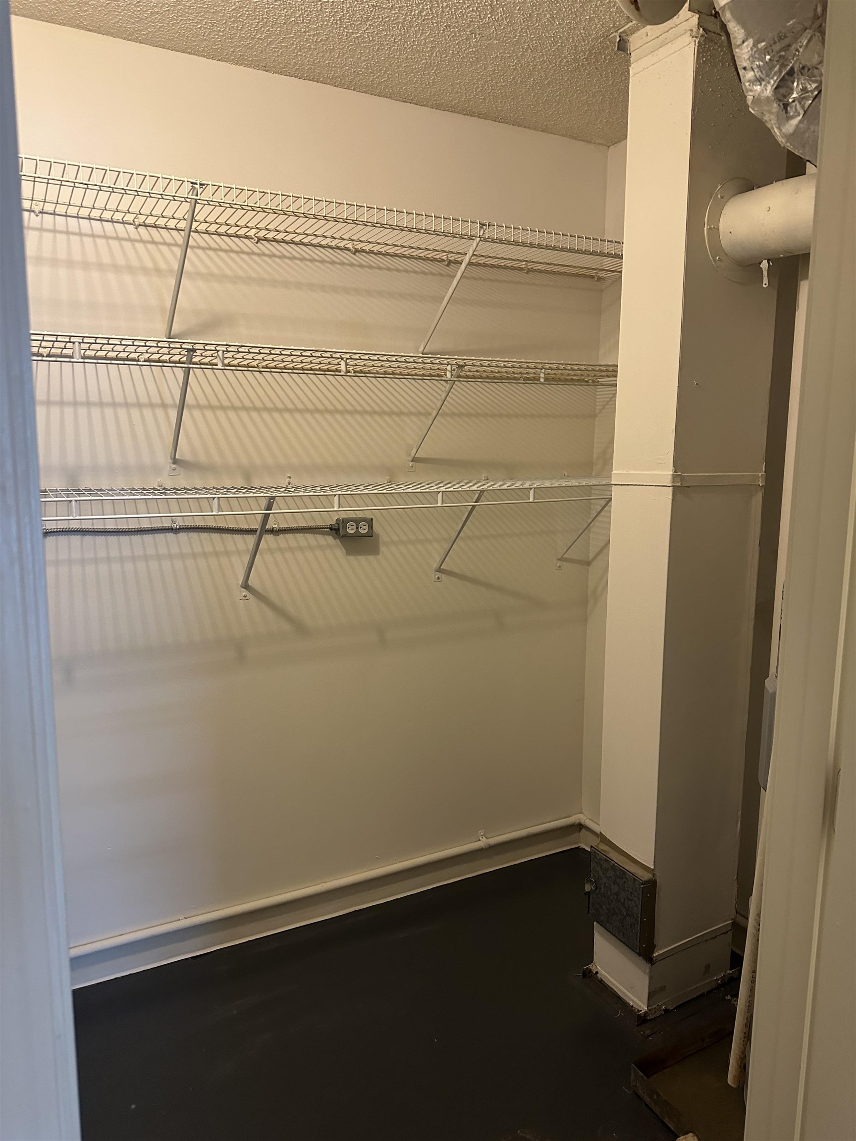 3589 Covington Pike, Unit 214 Memphis, TN 38128 - Photo 11 of 12 a view of a room with racks on the wall