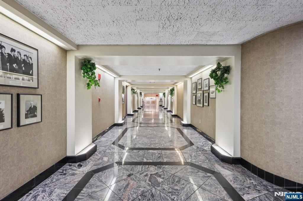 111 Mulberry Street, Unit 2V Newark, NJ 07102 - Photo 2 of 27 a view of a hallway with furniture and a window