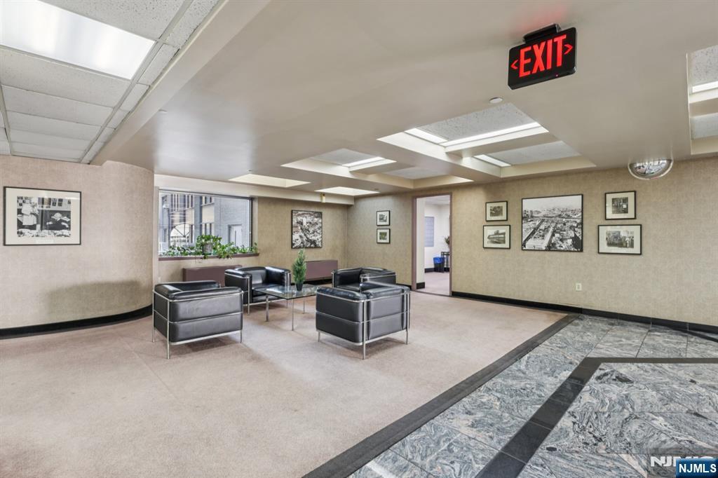 111 Mulberry Street, Unit 2V Newark, NJ 07102 - Photo 24 of 27 a living room with furniture and a window