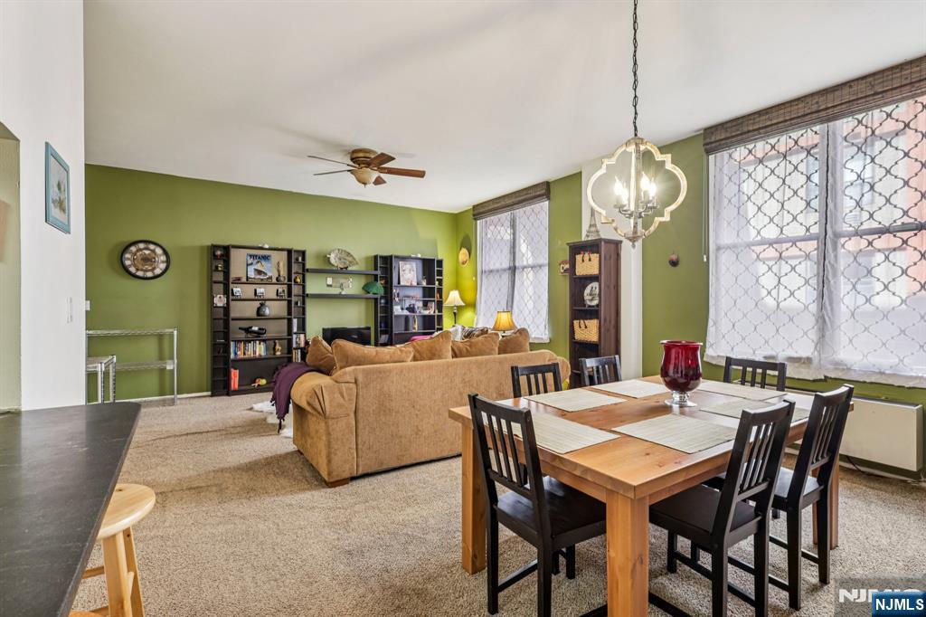 111 Mulberry Street, Unit 2V Newark, NJ 07102 - Photo 8 of 27 a view of a dining room with furniture window and outside view