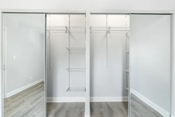 a bathroom with a glass shower door