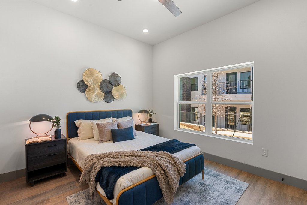 2450 Wickersham Lane, Unit 2012 Austin, TX 78741 - Photo 14 of 36 2nd Bedroom with wood finished floors, ceiling fan, and recessed lighting