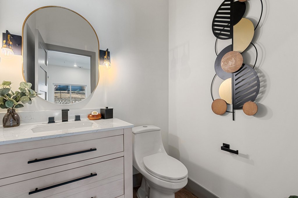 2450 Wickersham Lane, Unit 2012 Austin, TX 78741 - Photo 18 of 36 Guest Powder Room with vanity and toilet, in main living area