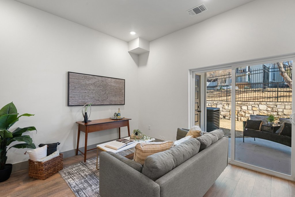 2450 Wickersham Lane, Unit 2012 Austin, TX 78741 - Photo 20 of 36 Living area with wood finished floors and recessed lighting