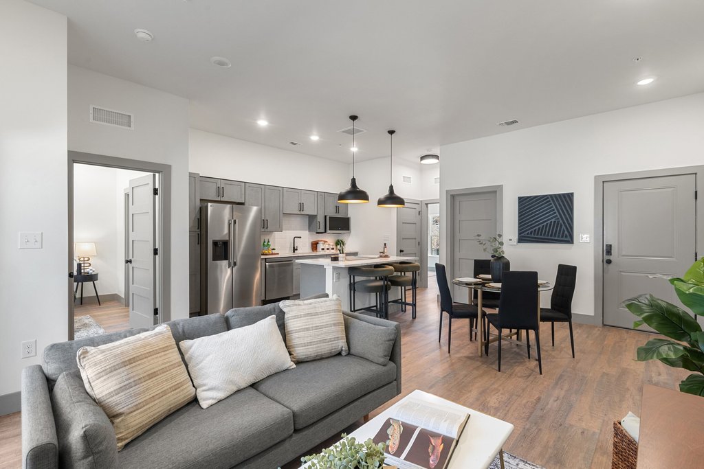 2450 Wickersham Lane, Unit 2012 Austin, TX 78741 - Photo 21 of 36 Living room with light wood-type flooring and recessed lighting