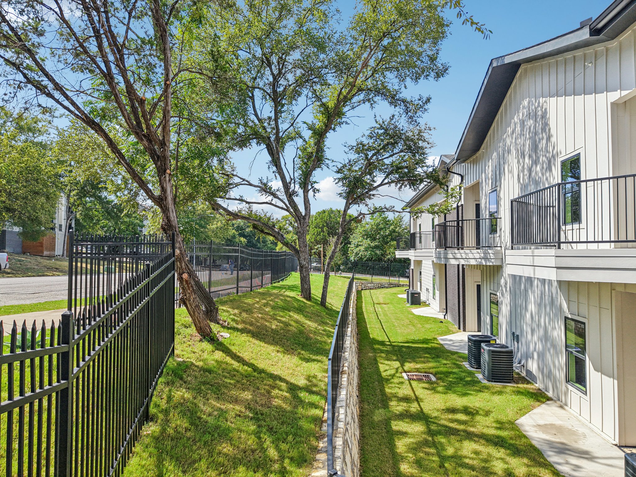 2450 Wickersham Lane, Unit 2012 Austin, TX 78741 - Photo 27 of 36 View of yard featuring a balcony