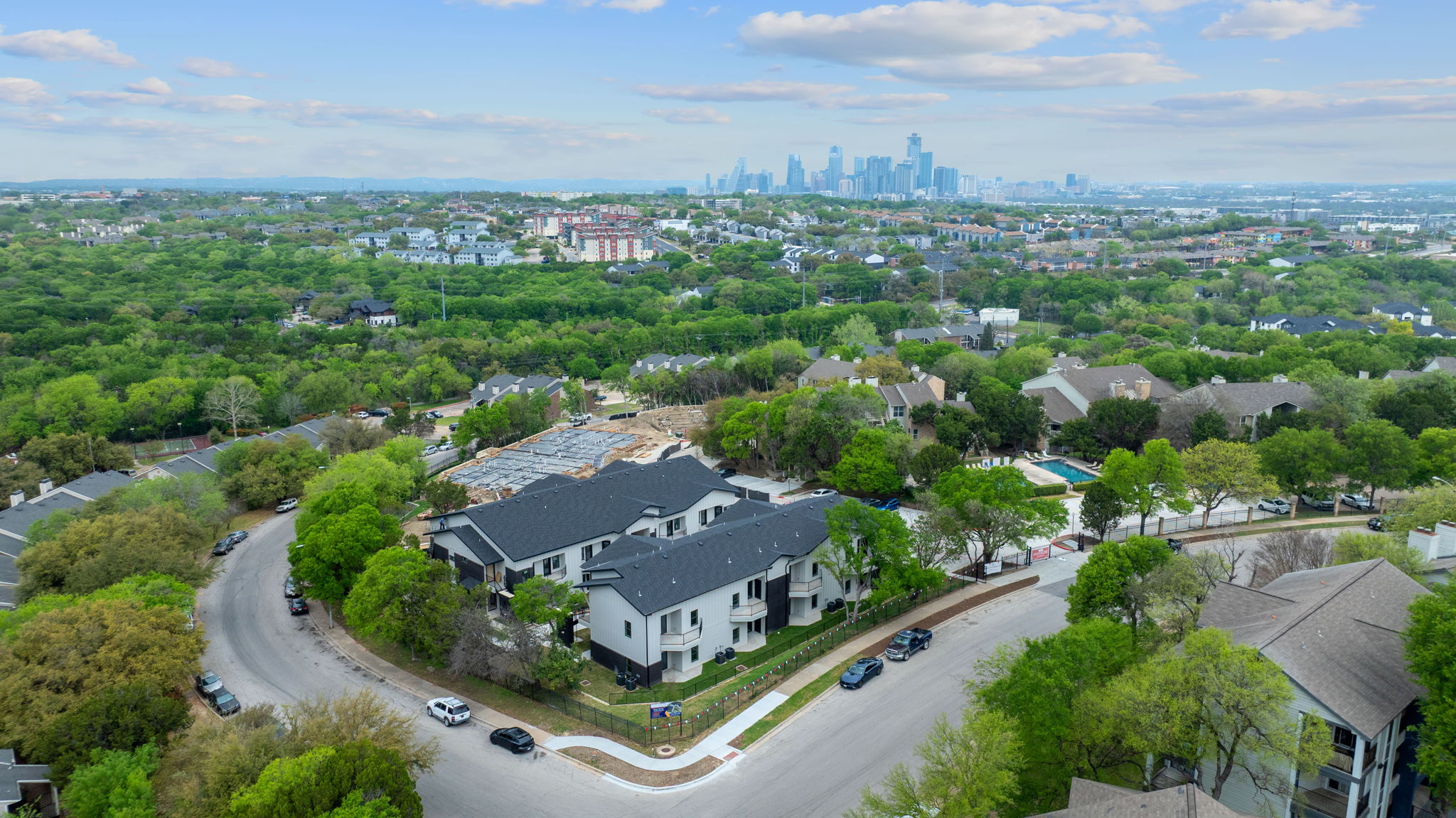 2450 Wickersham Lane, Unit 2012 Austin, TX 78741 - Photo 34 of 36 Drone / aerial view of city skyline