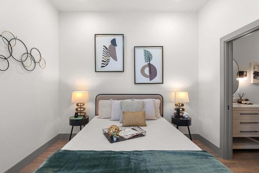 2450 Wickersham Lane, Unit 2012 Austin, TX 78741 - Photo 8 of 36 Bedroom featuring dark wood-type flooring and baseboards