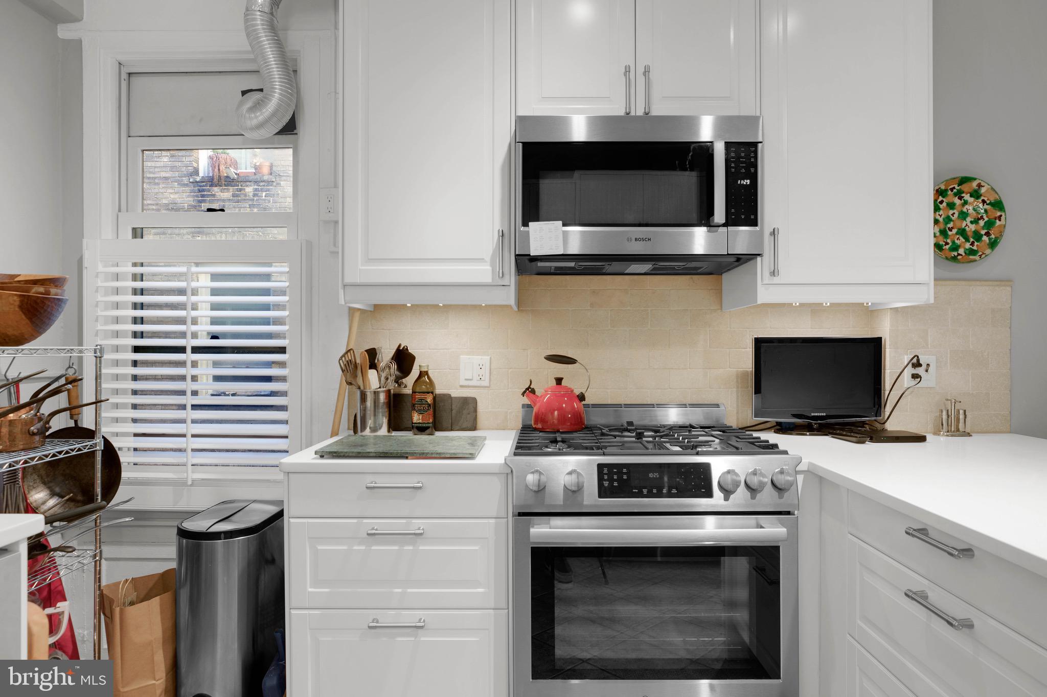 1736 Columbia Road Northwest, Unit 301 Washington, DC 20009 - Photo 13 of 68 Microwave vented to exterior plus gas cooking