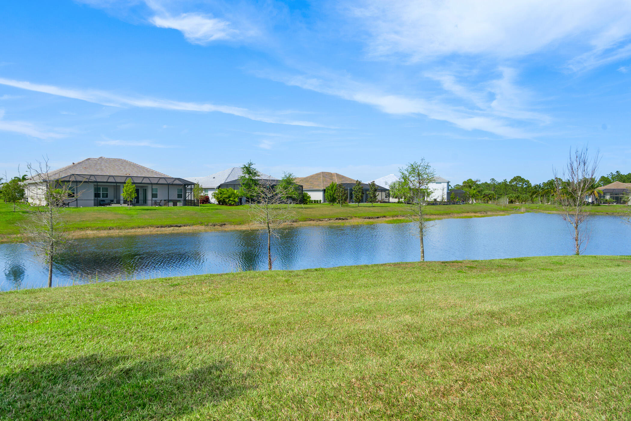 Undisclosed Address Vero Beach, FL 32967 - Photo 27 of 35 a view of a lake with houses in the back