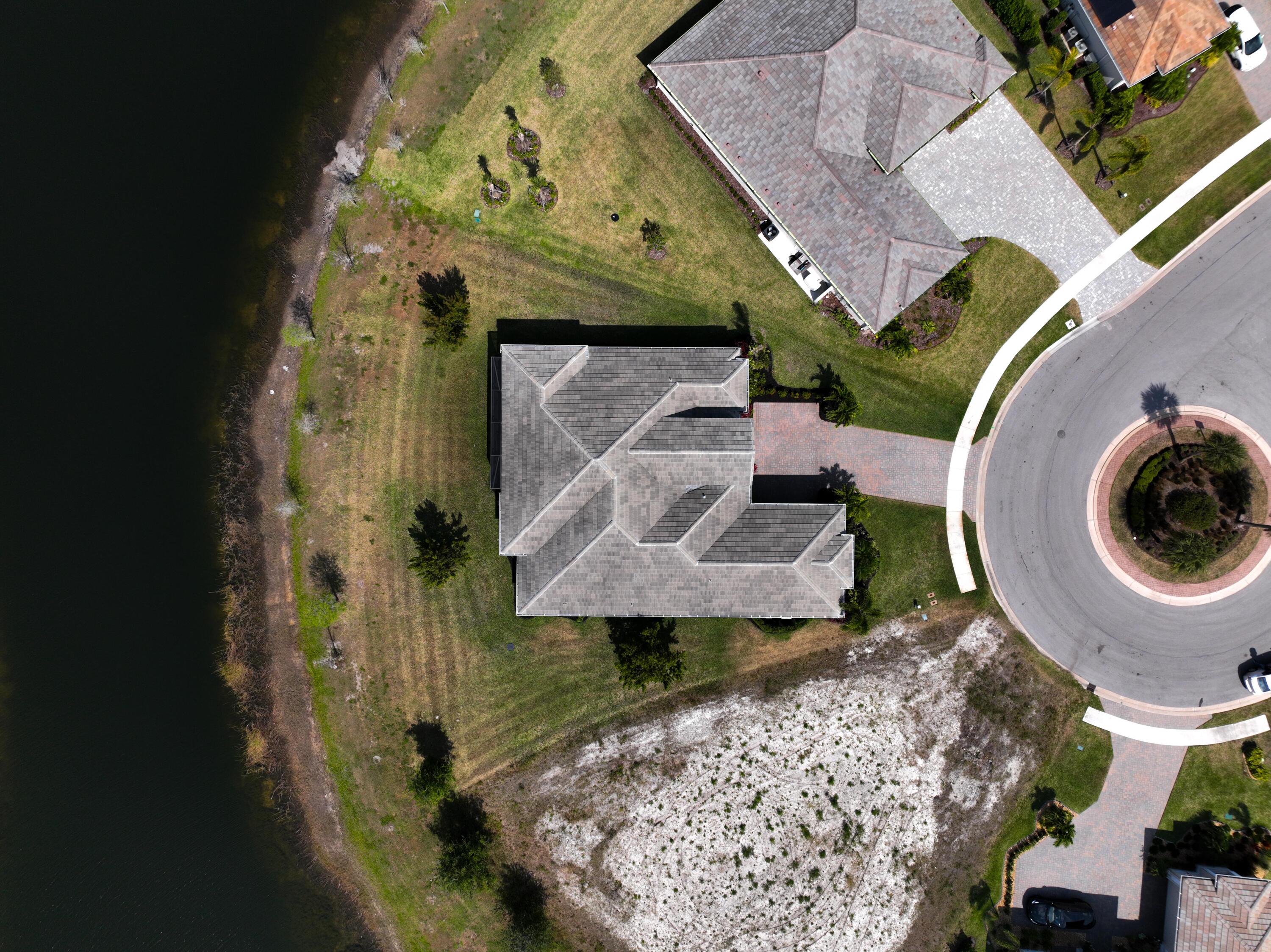 Undisclosed Address Vero Beach, FL 32967 - Photo 28 of 35 an aerial view of a house with a garden