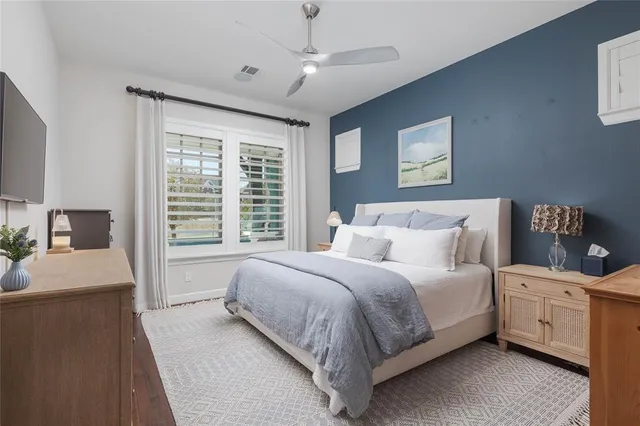 a bedroom with a bed and a couch