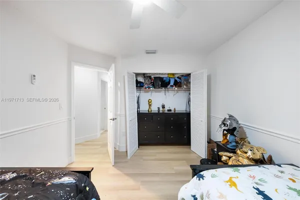 a bedroom with furniture and a window