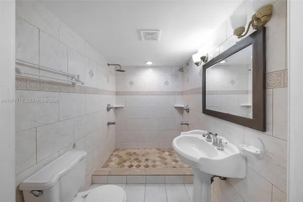 a view of a hallway with a bathtub in a hallway