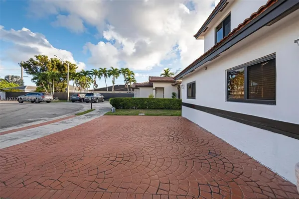 a view of a house with a street