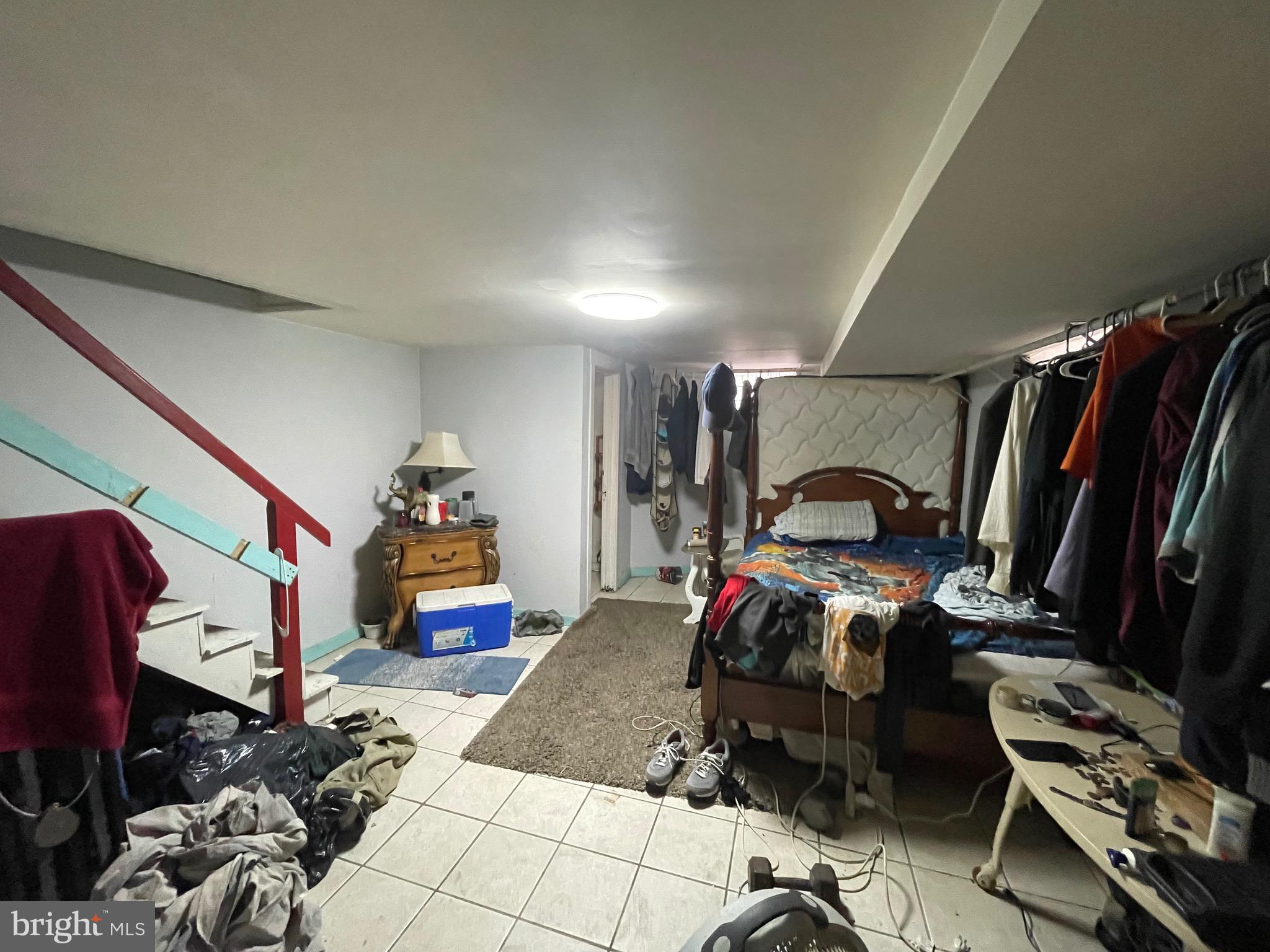 1141 Gilham Street Philadelphia, PA 19111 - Photo 12 of 16 a bedroom with furniture and a gym equipment