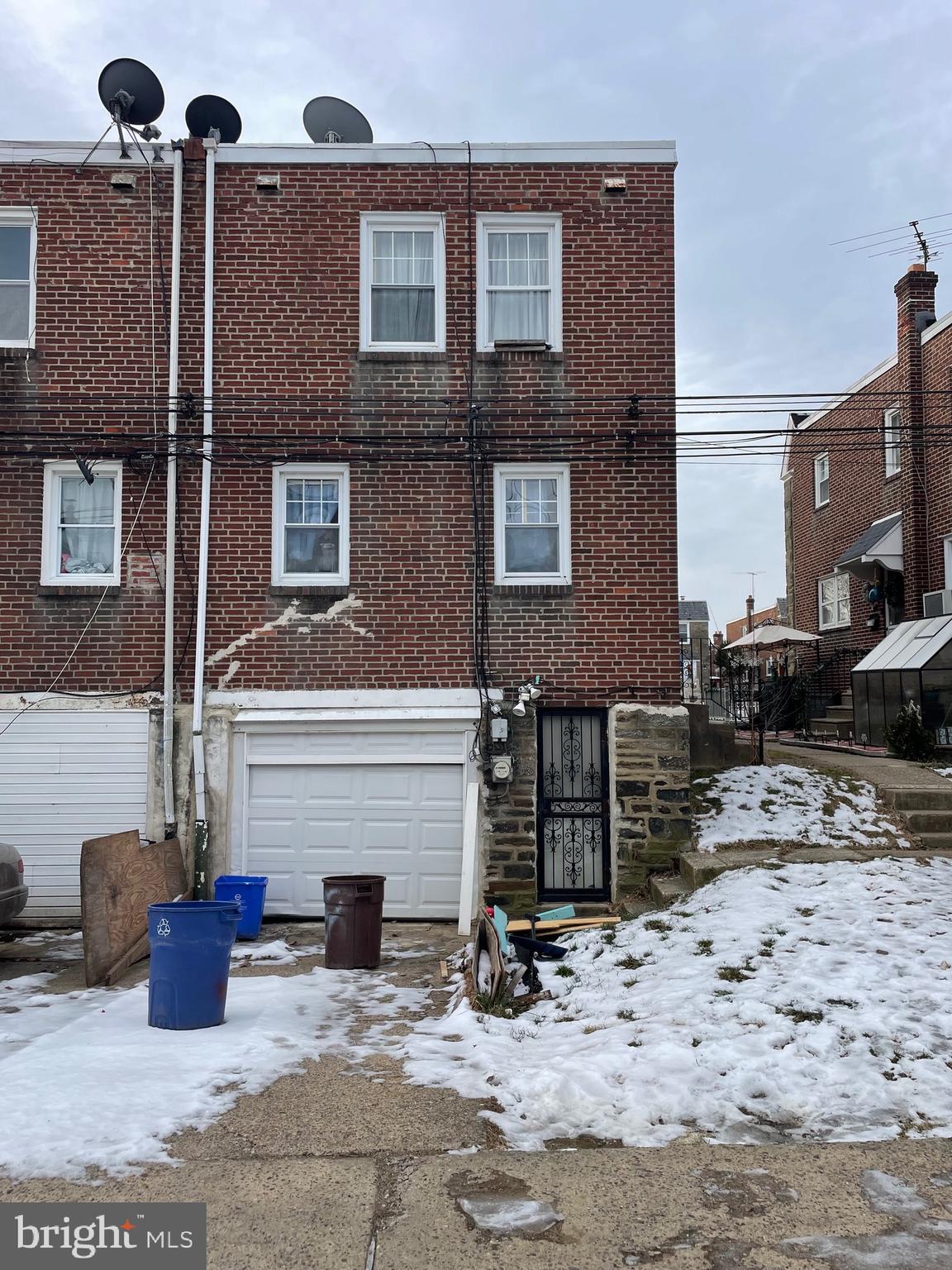 1141 Gilham Street Philadelphia, PA 19111 - Photo 16 of 16 a front view of a house with yard and parking space