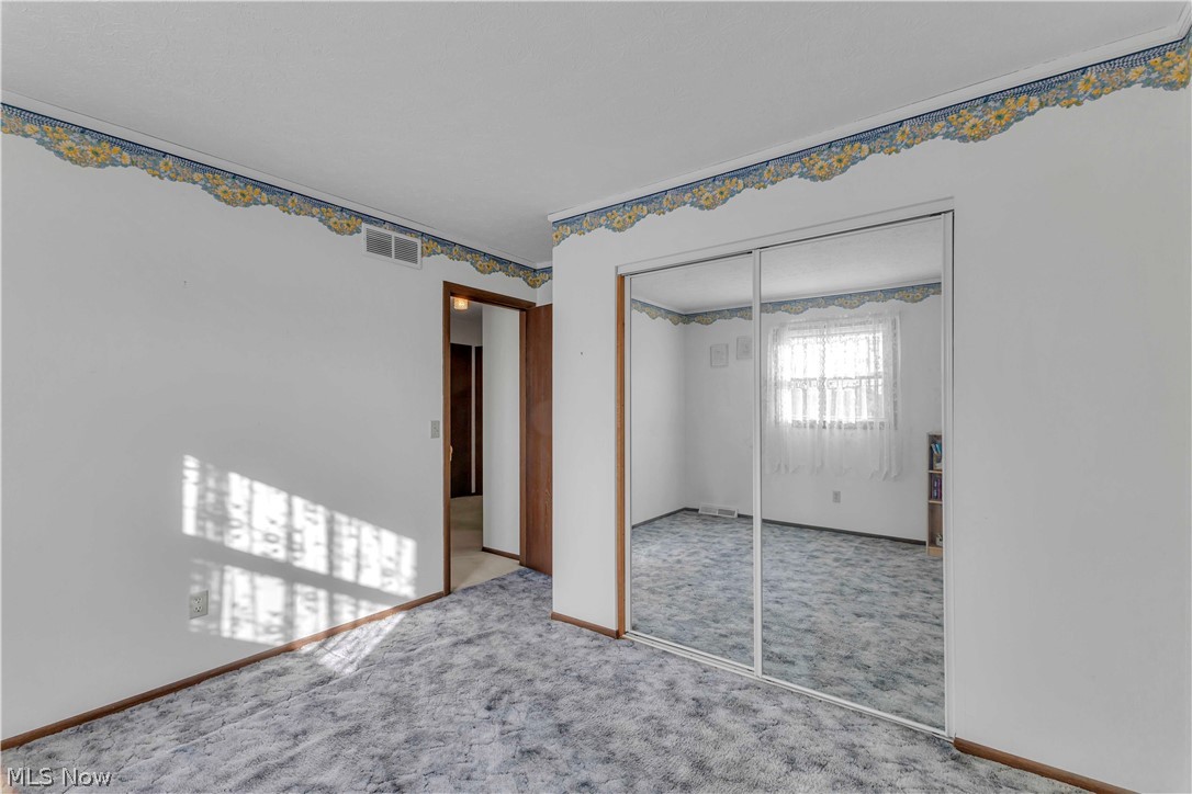 563 North Carpenter Road Brunswick, OH 44212 - Photo 24 of 45 Unfurnished bedroom with a closet and carpet floors