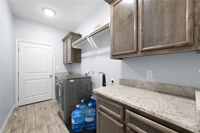 a kitchen with a sink and cabinets