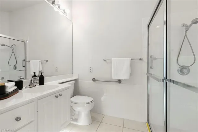 a bathroom with a toilet sink and shower