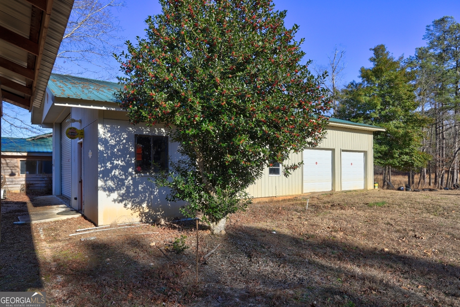 362 Brook Road Barnesville, GA 30204 - Photo 12 of 70 a view of a house with a yard and garage