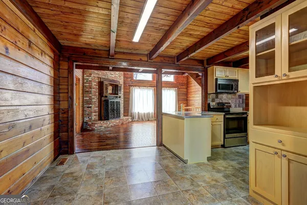a view of a livingroom with wooden floor and chandelier