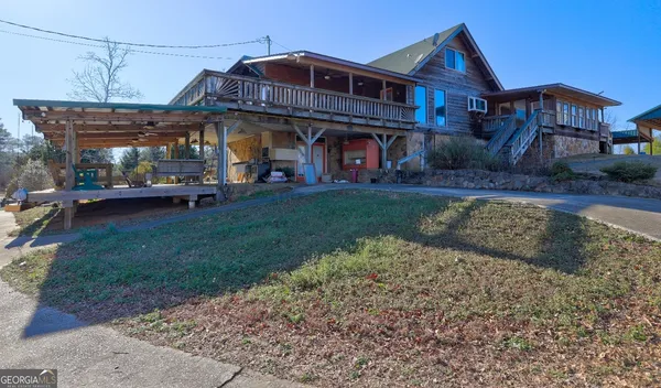 a view of a big house with a yard