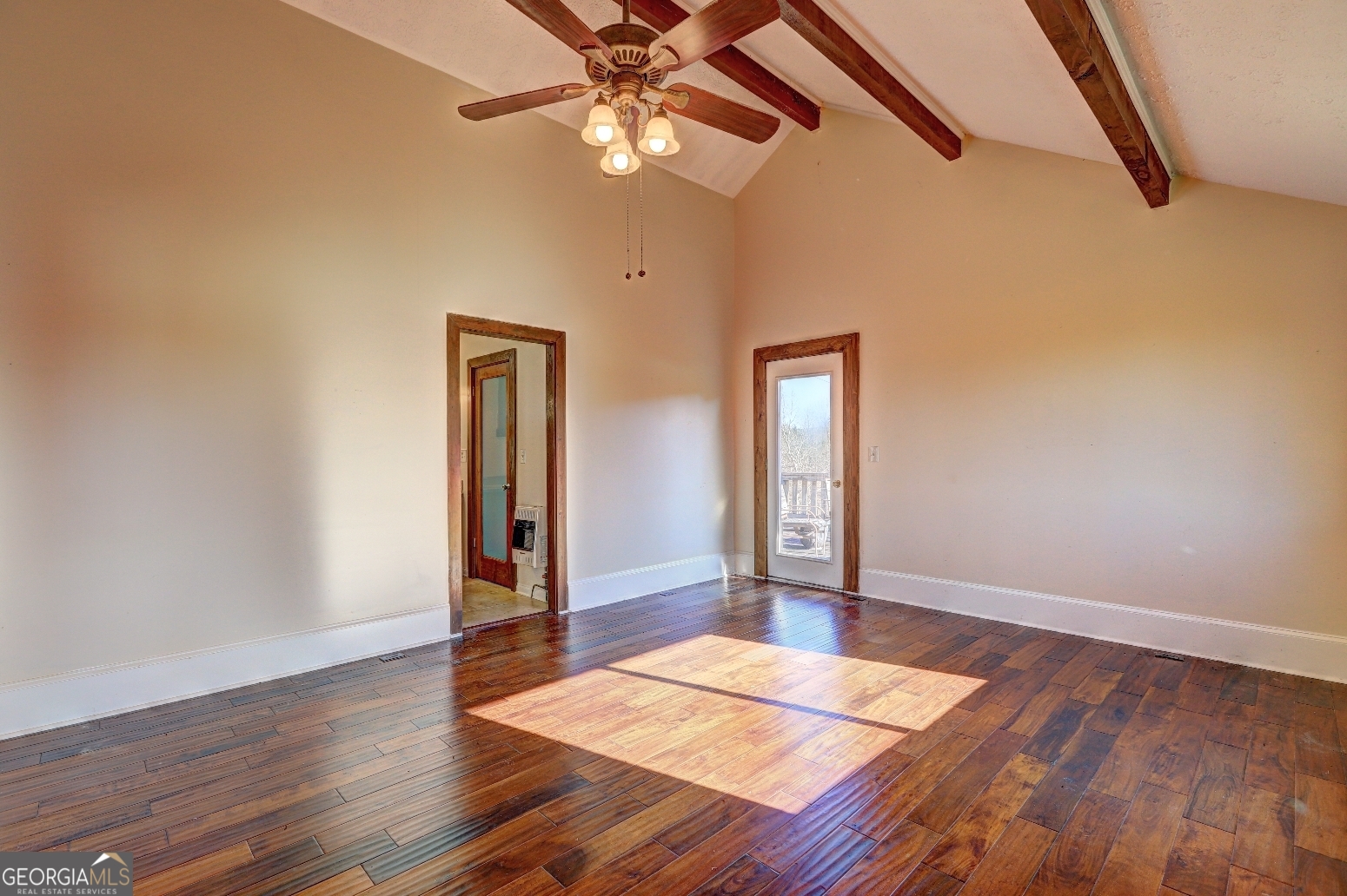 362 Brook Road Barnesville, GA 30204 - Photo 41 of 70 a view of an empty room with window and wooden floor