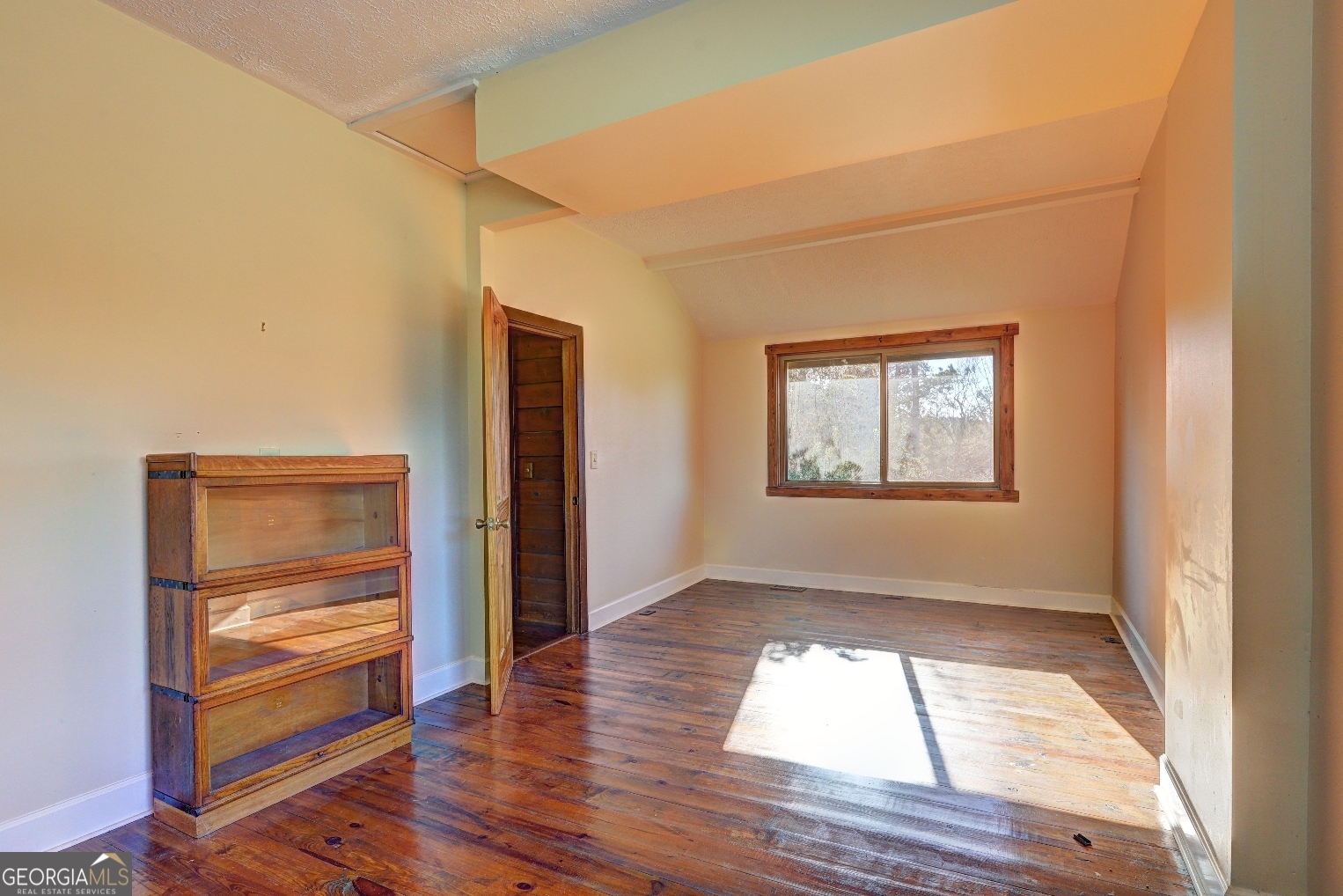 362 Brook Road Barnesville, GA 30204 - Photo 52 of 70 an empty room with wooden floor closet and windows