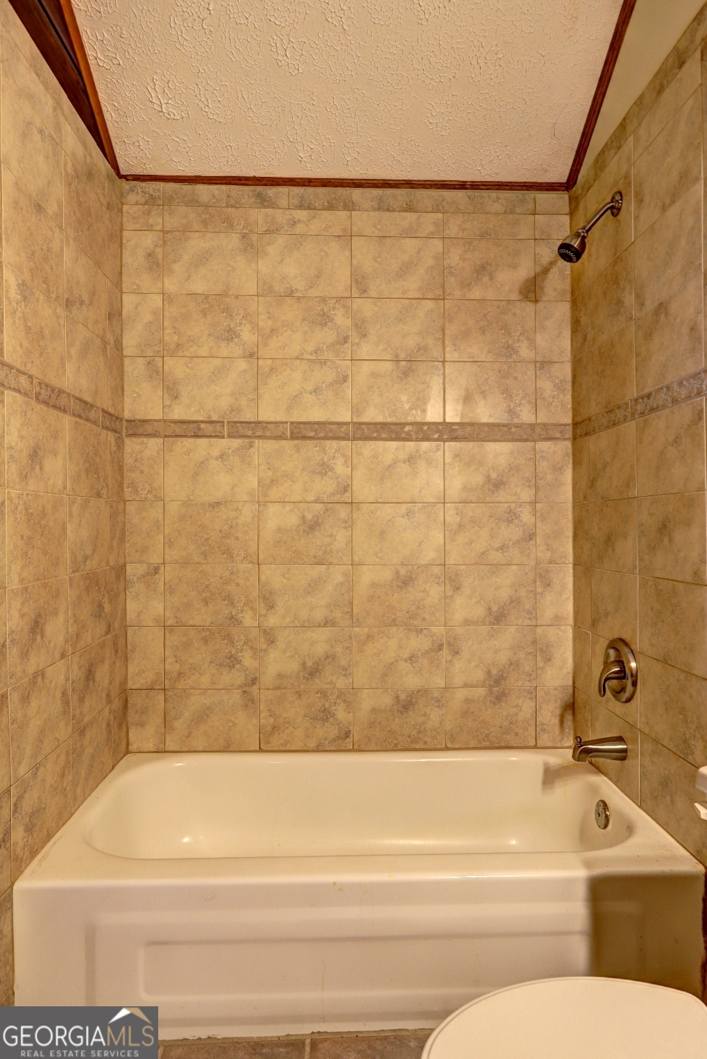 362 Brook Road Barnesville, GA 30204 - Photo 55 of 70 a bathroom with a shower and a bathtub