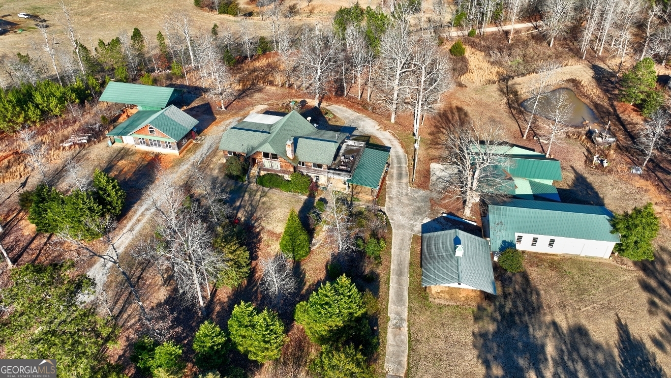 362 Brook Road Barnesville, GA 30204 - Photo 64 of 70 an aerial view of a residential apartment building with a yard and parking spaces