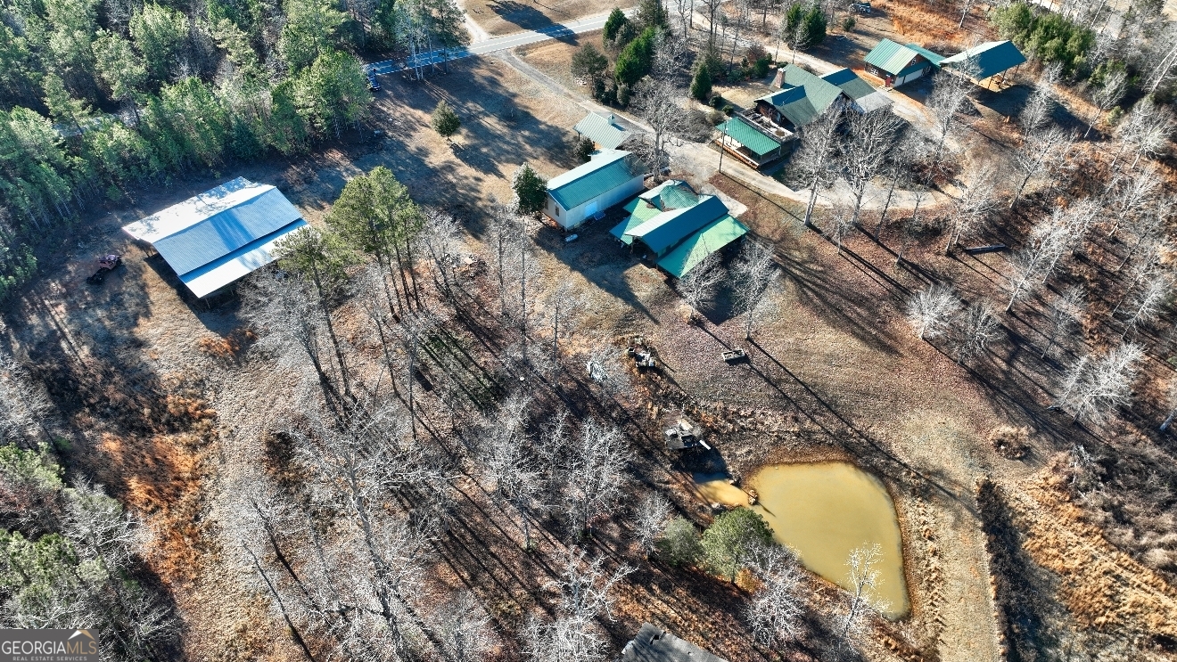 362 Brook Road Barnesville, GA 30204 - Photo 69 of 70 a aerial view of a house with a swimming pool and outdoor space