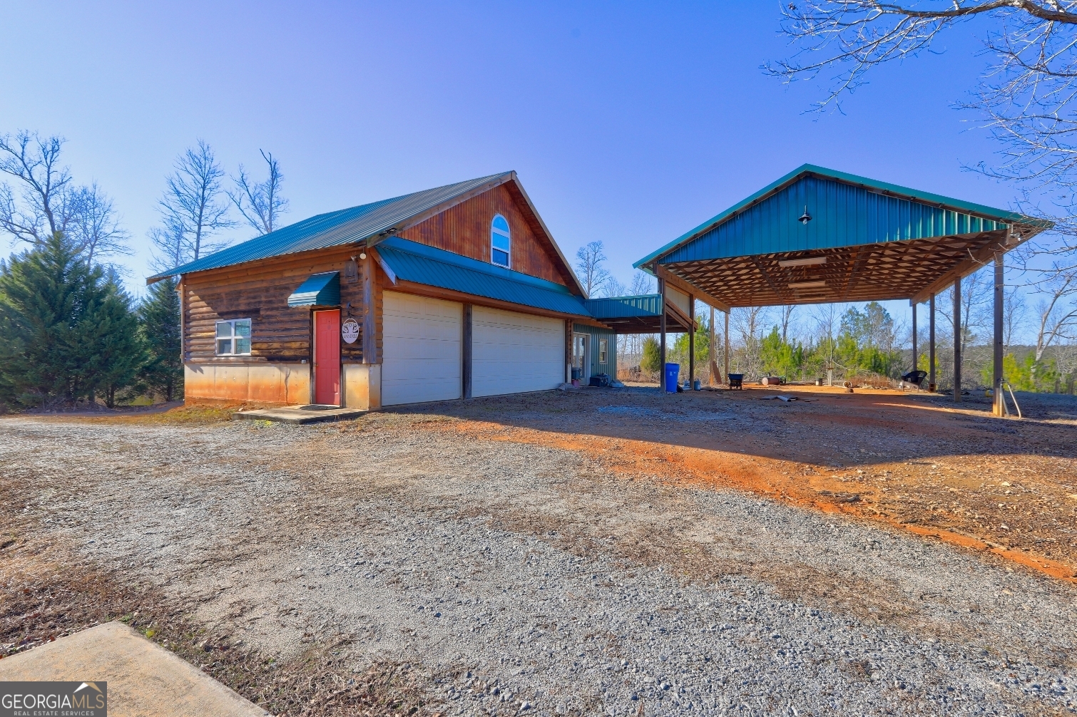 362 Brook Road Barnesville, GA 30204 - Photo 7 of 70 a view of a house with a yard and garage