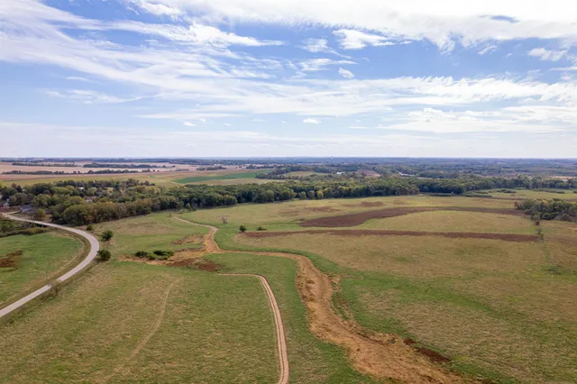an aerial view of a house with a yard