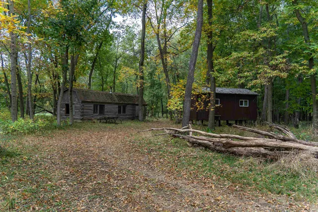 a view of a wooden deck with a forest